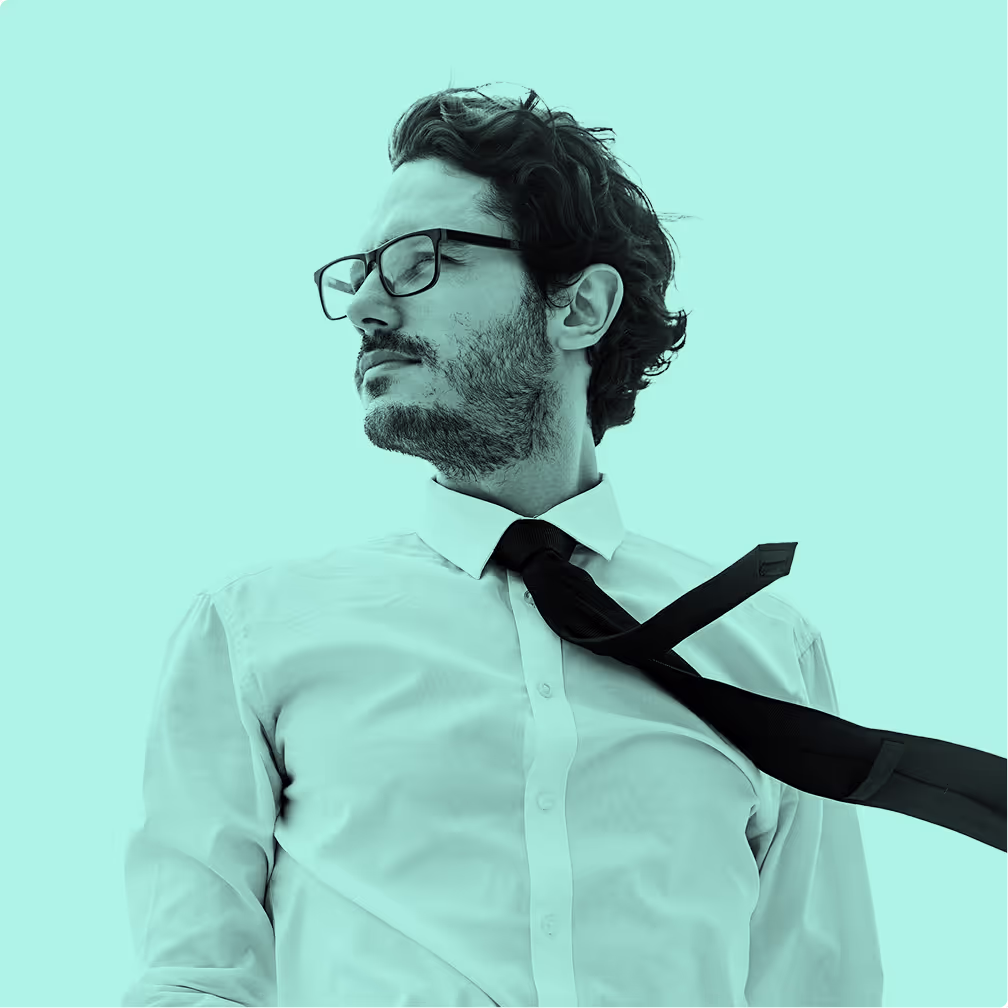 A man wearing glasses and a black tie.