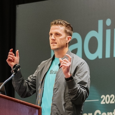 A man speaking in front of an audience