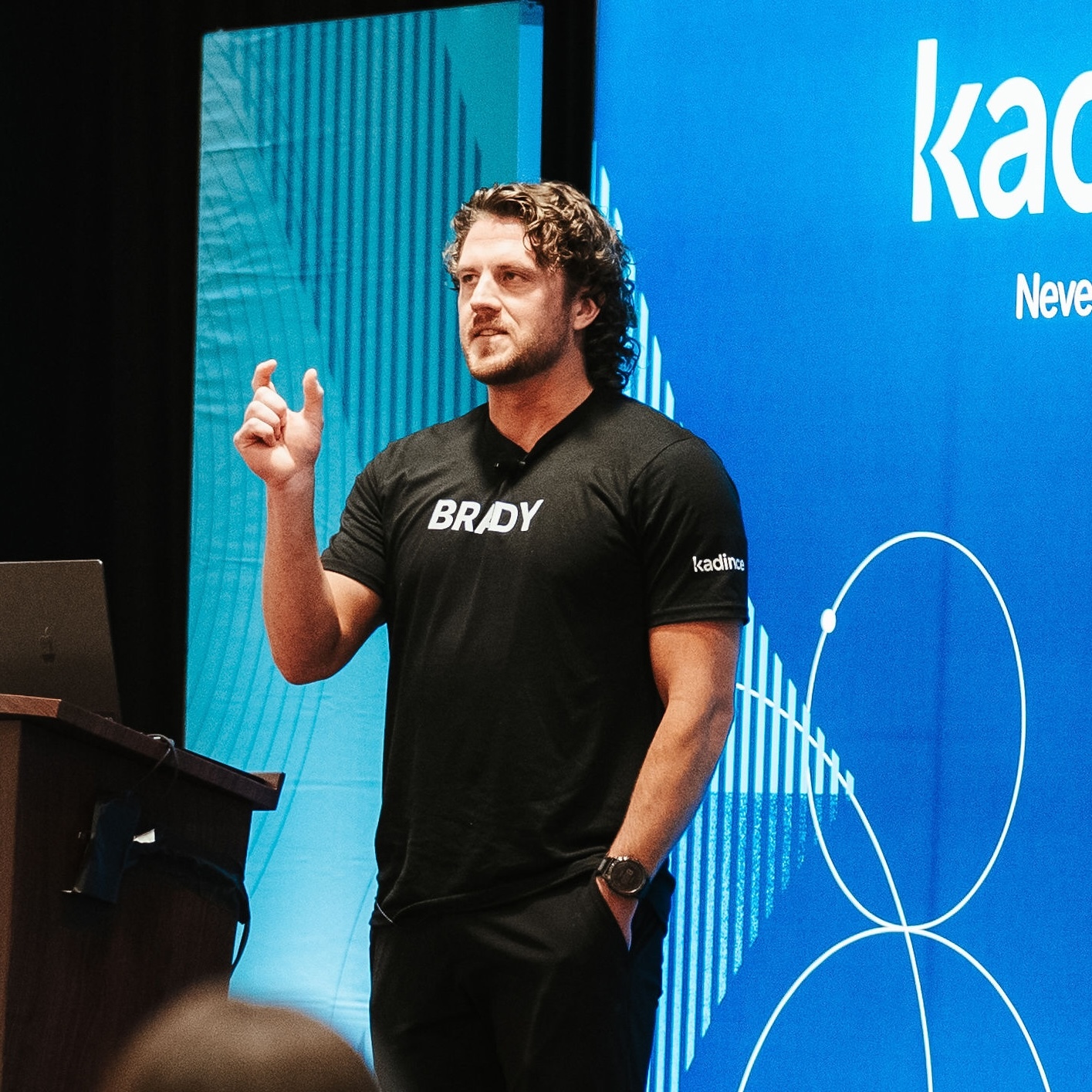 A man speaking in front of an audience