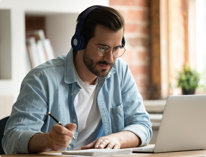 A woman preparing for an HMDA exam with a laptop.