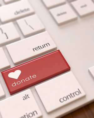 Donate button on a keyboard encouraging followers to support a cause on social media
